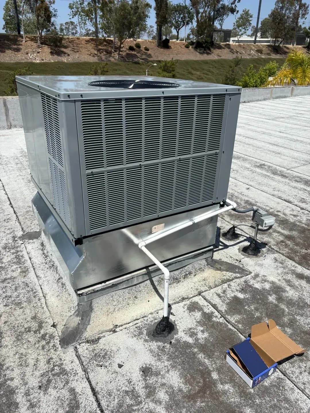 A newly installed outdoor AC condenser beside a San Diego home