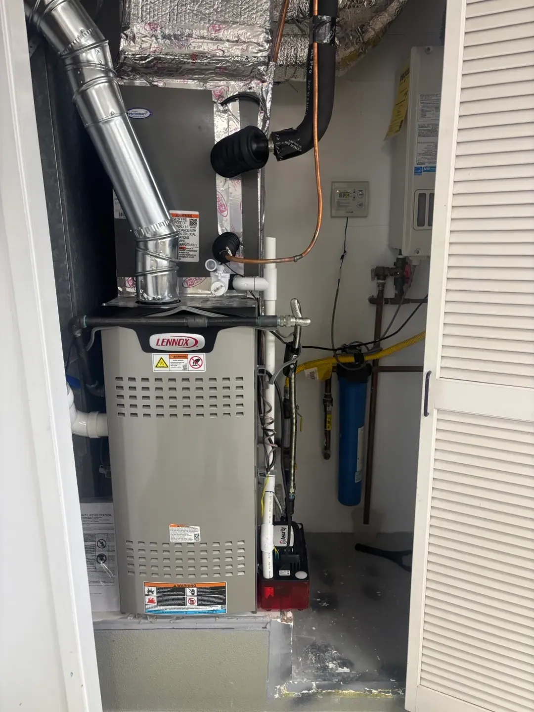 A residential gas furnace during a San Diego heating service visit